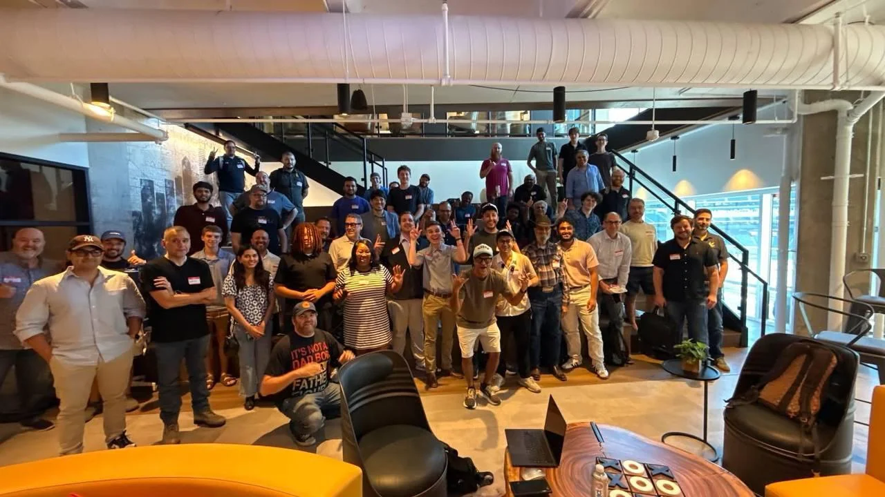 AI builders sharing a live demo at Node 06 in Arlington
